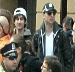 This photo released by the FBI shows what the FBI is calling the bombing suspects suspects at Boston Marathon.