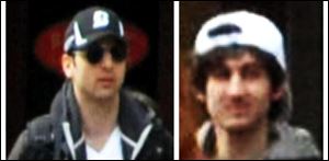This combo of photos released by the FBI shows what the FBI is calling suspects number 1, left, and suspect number 2, right,  walking through the crowd in Boston.