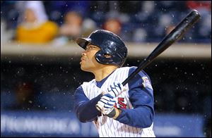 Toledo Mud Hens player John Lindsey hits an RBI triple in the fourth inning Friday against the Columbus Clippers in the second game at Fifth Third Field.