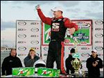  Johnny VanDoorn celebrates winning the 7Up 150 on Saturday night in the season opener at Toledo Speedway.