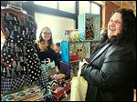  Betty Floored, left, a driving force behind the creation of Maker’s Mart, chats with Joellen Cherko of Northwood. The pop-up shop featured about 50 vendors from Ohio and Michigan.