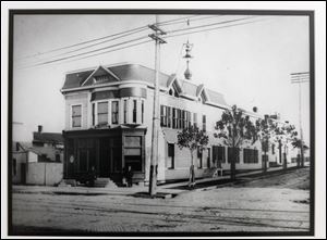 A copy of a photo of the original Coyle Funeral Home on Broadway at Logan Street in Toledo, taken in 1905. Copy made on April 16, 2013.