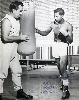Buddy Carr, left, trains with William 