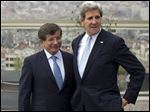  Turkish Foreign Minister Ahmet Davutoglu, left, shows U.S. Secretary of State John Kerry, the skyline of Istanbul before the start of a meeting on Sunday, April 21, 2013, in Istanbul, Turkey. Kerry is wrapping up a 24-hour visit to Istanbul with talks aimed at improving ties between Turkey and Israel and pushing ahead with Mideast peace efforts. (AP Photo/Evan Vucci, Pool) 
