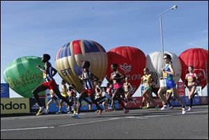The elite women's marathon runners start their race during the London Marathon, London, today.