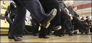 Dancers perform a scuff step during adult tap lessons at Off Broadway Dance Company at Common Space in Toledo.