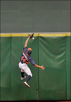 The Astros' Justin Maxwell cannot make the catch, giving the Indians' Yan Gomes a triple.