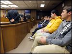  Anthony Wayne seniors Anthony Ulman, right, and Chris Wolfe, second from right, listen with other students from Pat Phillips’ business law class as they visit Judge Michael Goulding’s courtroom.