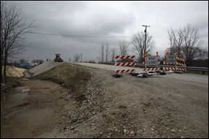 Embankment reconstruction is ongoing where Karbler Road bridges  the Ohio Turnpike near Fremont. Soil composition has caused the embankment to slip when it gets wet. 