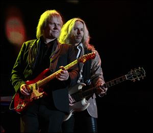 James ‘JY’ Young, left, and Tommy Shaw of Styx perform at the Huntington Center, playing to their faithful fan base. Styx was arguably the biggest draw to the megaconcert in Toledo.
