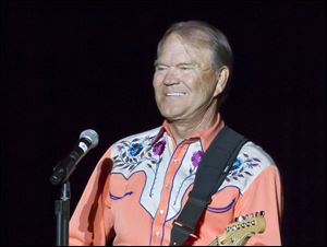 Singer Glen Campbell performs during his Goodbye Tour in Little Rock, Ark., September, 2012.