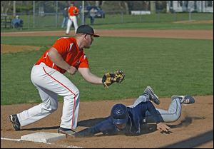 Otsego first baseman Hunter Donald tags out Lake's Jayce Vancena after a pick-off throw from Ryan Smoyer.