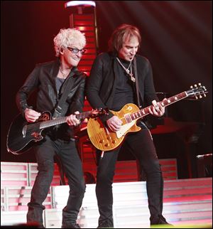 REO Speedwagon's vocalist Kevin Cronin, left, with lead guitarist Dave Amato. Cronin, at 61, has kept his high vocal range. 