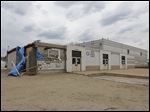  Former Leverette Elementary, 1111 E. Manhattan Blvd, ws burglarized after a surveillance camera's motor ran out of gas. 