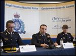  Assistant Commissioner James Maliza, officer in charge of Federal Policing Operations, center, is flanked by Chief Superintendent Gaetan Courchesne, Royal Canadian Mounted Police criminal operations officer in the province of Quebec, left, and Chief Superintendent Jennifer Strachan RCMP criminal operations officer in the province of Ontario at a news conference in Toronto on Monday.