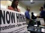  In this Thursday, Oct. 25, 2012, photo, a sign attracts job-seekers during a job fair at the Marriott Hotel in Colonie, N.Y. According to government reports released Friday, Nov. 2, 2012, the U.S. economy added 171,000 jobs in October, and the unemployment rate ticked up to 7.9 percent. (AP Photo/Mike Groll)