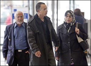 Family members of 18 year-old Abdella Ahmad Tounisi, including his father Ahmad Tounisi, center, leave the Dirksen Federal Building after the Chicago-area teen was charged with trying to join an al-Qaida-affiliated group in Syria.