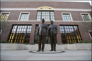 Statues of former Presidents George W. Bush, left and George HW Bush are seen during a tour of the George W. Bush Presidential Center.