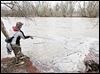 Andy Borton of Wauseon fishes the Maumee River at Side Cut Metropark in Maumee. Swift currents make wading treacherous; debris interferes near shore.