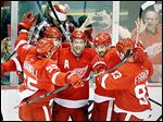  From left to right, Red Wings Niklas Kronwall, Jakub Kindl, Pavel Datsyuk, Henrik Zetterberg, and Johan Franzen celebrate Datsyuk's goal during the second period.