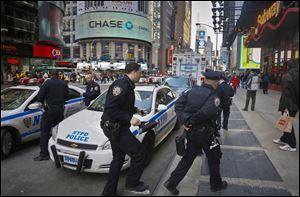 Police monitor New York's Times Square during an increase in security following an explosion at the finish line of the 2013 Boston Marathon on Monday, April 15, 2013. The two bombing suspects reportedly had plans to hit Times Square some time after the marathon.