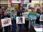  Perrysburg High School students show off their historic home paintings.