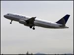  In this April 23, 2013 photo, a United Airlines jet departs in view of the air traffic control tower at Seattle-Tacoma International Airport in Seattle. With flight delays mounting, the Senate approved hurry-up legislation Thursday night to end air traffic controller furloughs.