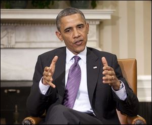 President Barack Obama answers a question on the ongoing conflict in Syria. 