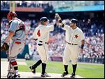  Detroit's Omar Infante is greeted by teammate Alex Avila after Infante's home run in the fourth inning. The Tigers were able to score five runs off Atlanta starting pitcher Kris Medlen.