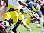  Michigan’s Denard Robinson was selected by Jacksonville in the fifth round on Saturday, the first Wolverine picked this year.