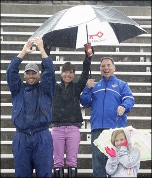 Rainy, cool weather didn't keep fans from turning out to cheer on the runners  at the University of Toledo.