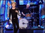 Mick Jagger, left, and Charlie Watts of the Rolling Stones, shown performing in December in Newark, N.J., played a surprise warm-up date in a small club in Los Angeles Saturday before kicking off their 50 and Counting tour later this week.