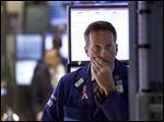  Specialist Glenn Carell works at his post on the floor of the New York Stock Exchange Monday, April 29, 2013.  A pair of encouraging economic reports helped propel the stock market up in early trading on Monday. (AP Photo/Richard Drew)