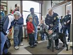  Woodville police Officer Steve Gilkerson introduces his new police dog, Raider, to 70 residents at the Woodville Public Library. Raider, a 14-month-old Dutch shepherd, came from Belgium and is still being trained. The dog is expected to be ready for duty by the third week of May.