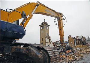 The demolition of St. Ignatius Catholic Church in Oregon, which dated to 1927, is near completion. The parish plans to open its new 11,931-square-foot church by March. The project cost is $3 million.