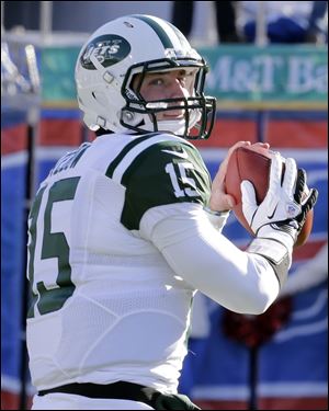 New York Jets quarterback Tim Tebow (15) warms up before an NFL football game against the Buffalo Bills in December.