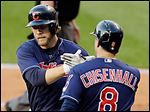  The Indians' Mark Reynolds, left, is congratulated by Lonnie Chisenhall after he hit a homer.