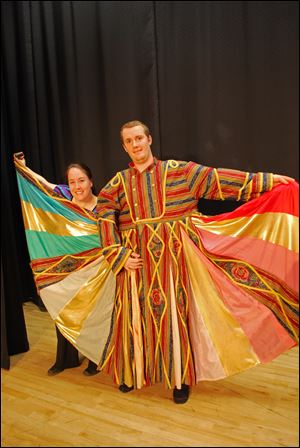 From left, Jaime Becker at the Narrator and Andy Dysard as Joseph in Waterville Playshop's production of 'Joseph and the Amazing Technicolor Dreamcoat.'