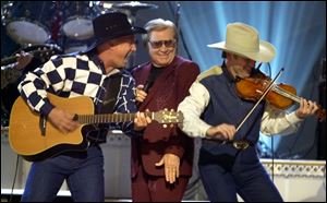 George Jones’ (center) vast catalog — he famously scored chart hits in five different decades — provided plenty of entry points for young fans to discover him without the baggage of country-music trend cycles.