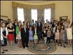  Former President George W. Bush, center, poses with 43 students from Dallas-Fort Worth Schools who were the first 43 official guest to tour the Bush Presidential Library on its' opening day in Dallas.