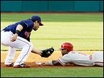  Cleveland's Jason Kipnis tags out Philadelphia's Jimmy Rollins at second base. The Indians have won four consecutive games.