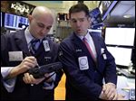  Trader Damian Bagarozza, left, and specialist David Haubner work on the floor of the New York Stock Exchange Thursday, May 2, 2013. Stocks are opening higher on Wall Street, a day after the market's biggest fall in two weeks, after General Motors and other big companies announced higher profits. (AP Photo/Richard Drew)