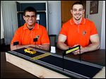  Bowling Green University engineering technology seniors Kevin Baumann, left, and Seth Cooper designed a system aimed to prevent wrong-way crashes. The effort was part of a ‘capstone’ senior project. They said they hoped a master’s student would take over the project.