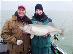  Lake Erie guide Ross Robertson, right, and angler Bruce Samson of Minnetrista, Minn., with a monster spring walleye they caught in April west of the Bass Islands in Lake Erie. The fish measured 29 inches long and weighed 10 pounds.