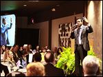  Sujo John, an Indian emigrant and survivor of the Sept. 11, 2001, terrorist attacks, speaks at the 24th annual Northwest Ohio Prayer Breakfast.