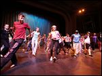  Students from the Toledo School for the Arts rehearse at the Ohio Theatre, from front left, Henry Tylinski, 13, Chloe Hudson, 13, and Khalil Carpenter, 12.