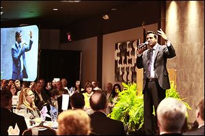 Sujo John, an Indian emigrant and survivor of the Sept. 11, 2001, terrorist attacks, speaks at the 24th annual Northwest Ohio Prayer Breakfast.