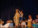  Brittanie Kuhr crowns a statue of Mary in 2009.