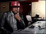  will.i.am poses for a portrait in Los Angeles. The Black Eyed Peas frontman is computer chip-maker Intel's director of creative innovation. He's also partnered with Coca-Cola to create a new brand of products from recycled bottles and cans, including headphones and clothes.
