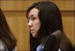 Defendant Jodi Arias listens to prosecutor Juan Martinez makes his closing arguments during her trial at Maricopa County Superior Court in Phoenix.